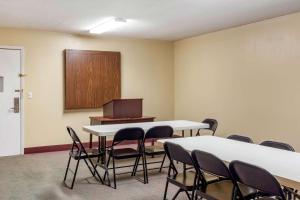 a conference room with tables and chairs and a podium at Econo Lodge Burlington I-40 in Burlington +21 photos