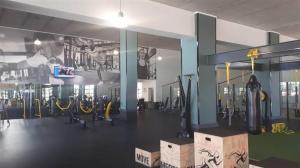 a gym with a bunch of equipment in it at The Blyde Crystal Lagoon One Bedroom Apartment in Pretoria