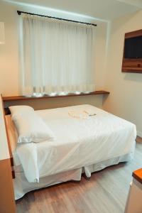 Cama ou camas em um quarto em Hotel Imperial de Quatro Barras
