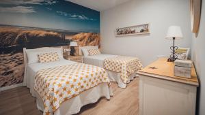 Posteľ alebo postele v izbe v ubytovaní Casa Playa Lavaxeira