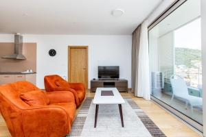 Ein Sitzbereich in der Unterkunft Apartments LORA in Apart-hotel