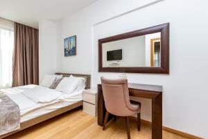 Ein Bett oder Betten in einem Zimmer der Unterkunft Apartments LORA in Apart-hotel