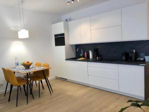 Kuchyňa alebo kuchynka v ubytovaní Apartament Nadmorski Kołobrzeg II