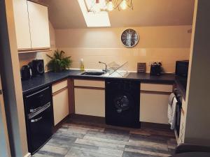 A kitchen or kitchenette at Clarabel's Guest House- The Cranny