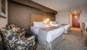 Postel nebo postele na pokoji v ubytování Monte Carlo Inn Vaughan Suites