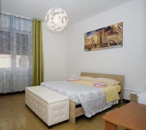 Een bed of bedden in een kamer bij Bologna Dream Apartments