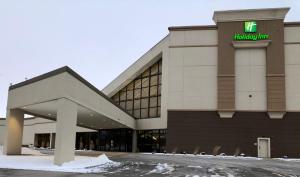 a hotel building with a hiltonium sign on it at Holiday Inn - Bloomington - Normal, an IHG Hotel in Normal