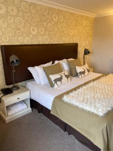 two beds in a hotel room with two beds sidx sidx sidx at No12 Hotel in North Berwick