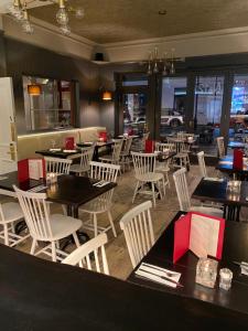 a dining room with tables and chairs in a restaurant at No12 Hotel in North Berwick