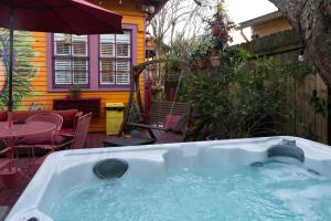 a hot tub in the backyard of a house at The Blue60 Marigny Inn in New Orleans