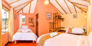 Rúm í herbergi á Hotel Kuntur Wassi