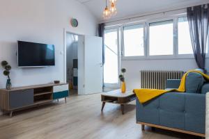 TV a/nebo společenská místnost v ubytování Kuki apartment with balcony