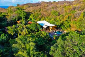 an aerial view of a house in the forest at Pousada do Vale in Fernando de Noronha
