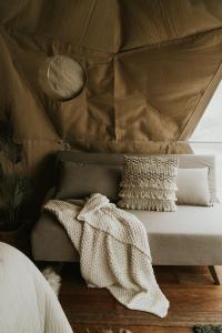 a bed with a canopy in a room at Glam camping Queenstown in Queenstown