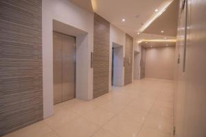 a hallway of a building with a elevator at 1523 MIGAs Haven at Sunvida across SM City in Cebu City
