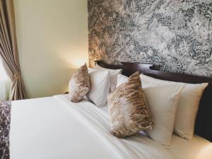 Postel nebo postele na pokoji v ubytování Praya Palazzo