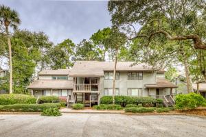 a large house with trees and a driveway at Fairway Oaks 1305 in Kiawah Island