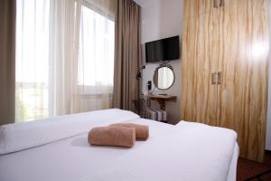 Posteľ alebo postele v izbe v ubytovaní Aviator Garni Hotel Bratislava