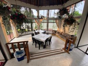 a large room with a table and a couch at Cabaña en Prado Tolima in Prado