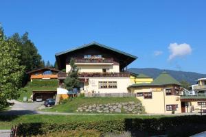a large house on top of a hill at Haus Sonnleitn in Altenmarkt im Pongau