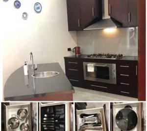 a kitchen with a sink and a microwave at Miss Victoria in Nerrina +6 photos