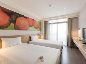 Katil atau katil-katil dalam bilik di Mellow Fields Hotel