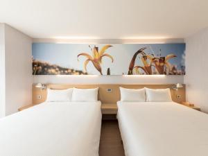Katil atau katil-katil dalam bilik di Mellow Fields Hotel