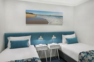 Postel nebo postele na pokoji v ubytování Watermark Resort Caloundra