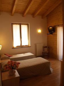 Postel nebo postele na pokoji v ubytování Residence Hotel Montegargnano