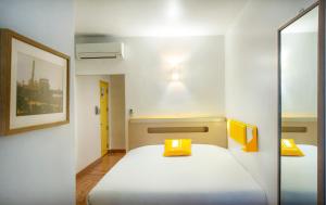 Letto o letti in una camera di bloomrooms @ Janpath