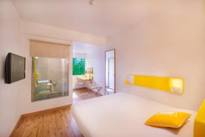Letto o letti in una camera di bloomrooms @ Janpath
