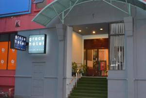 a entrance to a building with a sign on it at Grace Hotel Lahad Datu in Lahad Datu