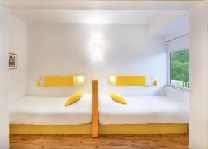 Letto o letti in una camera di bloomrooms @ Janpath
