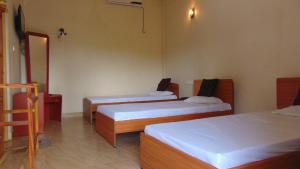 Katil atau katil-katil dalam bilik di Hotel Alas Garden