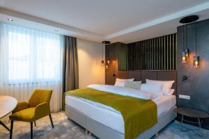Postel nebo postele na pokoji v ubytování Hotel Esplanade Dortmund