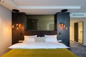 Postel nebo postele na pokoji v ubytování Hotel Esplanade Dortmund