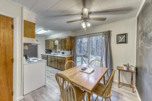 a kitchen with a table and a ceiling fan at Hermitville in Rutland