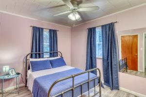 a bedroom with a bed and a ceiling fan at Hermitville in Rutland