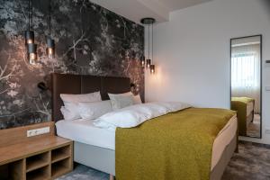 Postel nebo postele na pokoji v ubytování Hotel Esplanade Dortmund