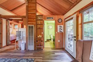 a room with wooden ceilings and a door to a bedroom at Dear Ol' Dad's Cabin in McKinleyville