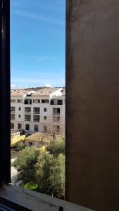a view of a city from a window of a building at Hôtel Restaurant le Bellevue in Propriano +38 photos