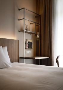 Ένα ή περισσότερα κρεβάτια σε δωμάτιο στο Sorell Hotel Zürichberg