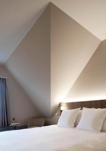 Ένα ή περισσότερα κρεβάτια σε δωμάτιο στο Sorell Hotel Zürichberg