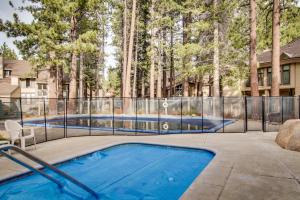 a swimming pool in a yard with a fence at St. Moritz 13 in Mammoth Lakes