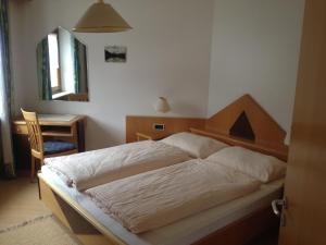 Postel nebo postele na pokoji v ubytování Garni Renzler