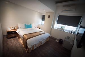 Postel nebo postele na pokoji v ubytování 237 Hotel
