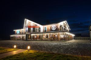 a building with lights on it at night at Geography in Veresneve