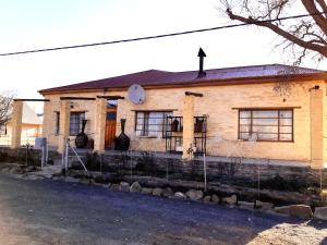 an old house with a cross on top of it at Sutherland Guest House in Sutherland