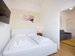 Łóżko lub łóżka w pokoju w obiekcie Vienna Stay Apartments Pezzl 1170