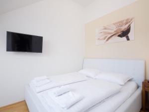 Łóżko lub łóżka w pokoju w obiekcie Vienna Stay Apartments Pezzl 1170